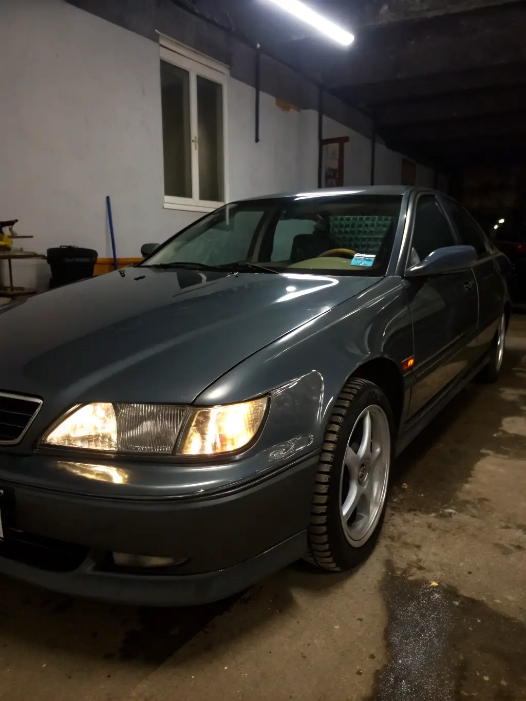 A photo of a fully repaired car, looking brand new, outside the WarlocksCollision shop in Aurora, Ontario.